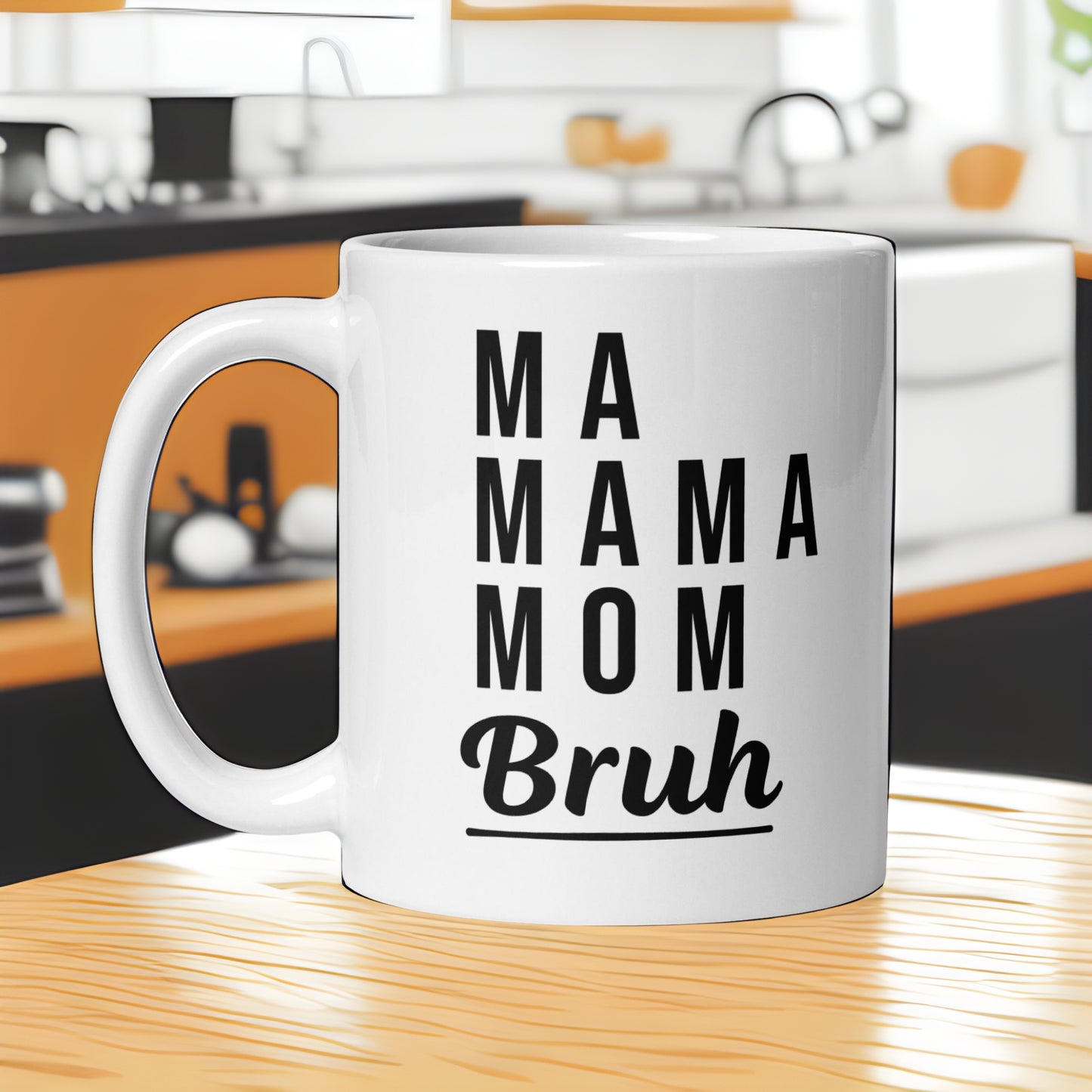White ceramic mug with "MA MAMA MOM Bruh" text on a kitchen counter. A funny humorous parenting mug, making it a great baby shower gift for expecting or new moms from Born Brash.