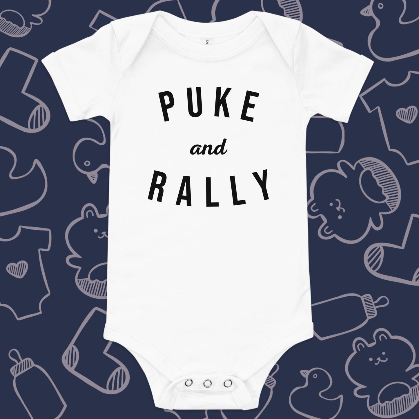 Funny, white baby onesie featuring the playful text "PUKE AND RALLY" against a whimsical, blue backdrop of ducks, socks, stuffed animals, baby bodysuits, and bottles