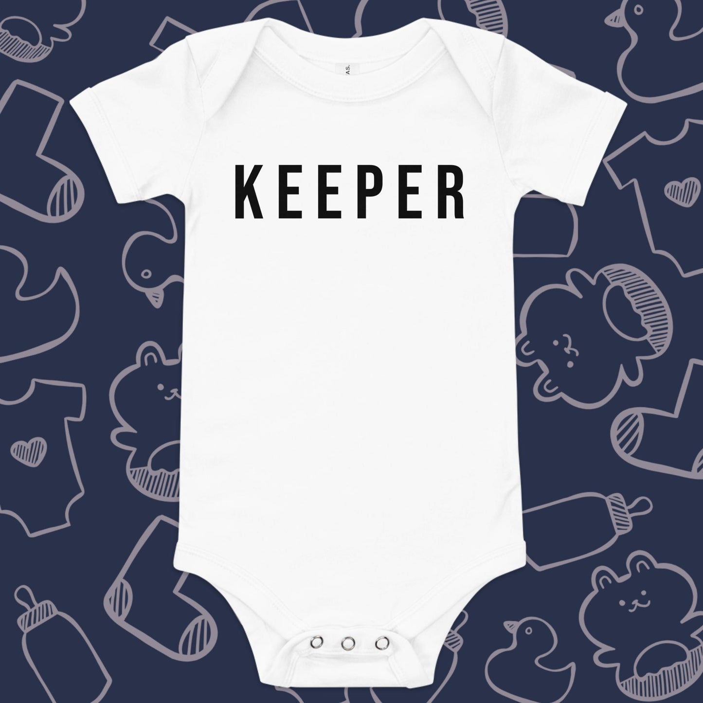 Funny, white baby onesie featuring the playful text "KEEPER" against a whimsical, blue backdrop of ducks, socks, stuffed animals, baby bodysuits, and bottles