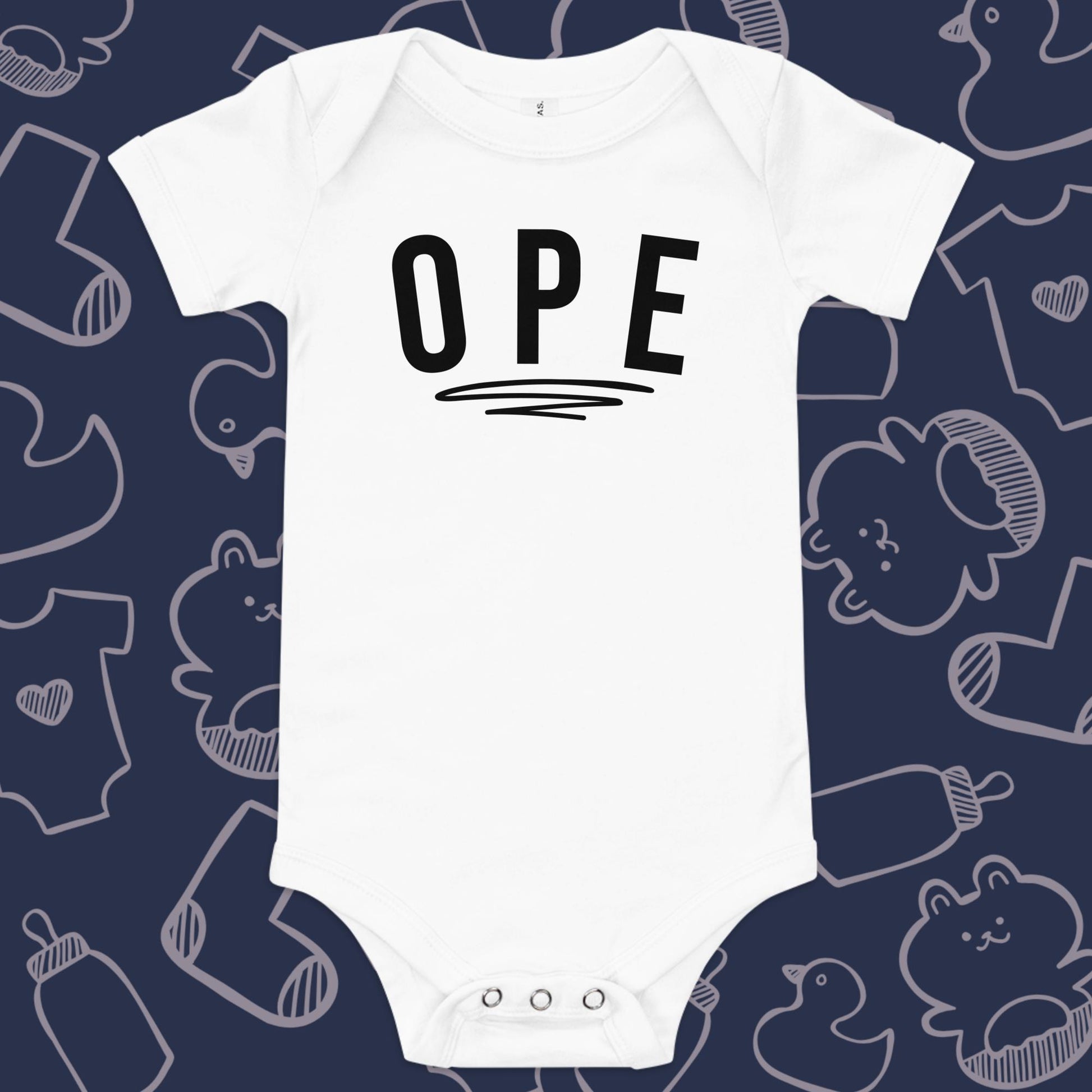 Funny, white baby onesie featuring the playful text "OPE" underlined against a whimsical, blue backdrop of ducks, socks, stuffed animals, baby bodysuits, and bottles