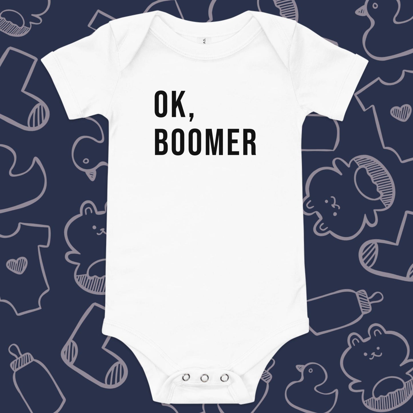 Funny, white baby onesie featuring the playful text "OK, BOOMER" against a whimsical, blue backdrop of ducks, socks, stuffed animals, baby bodysuits, and bottles