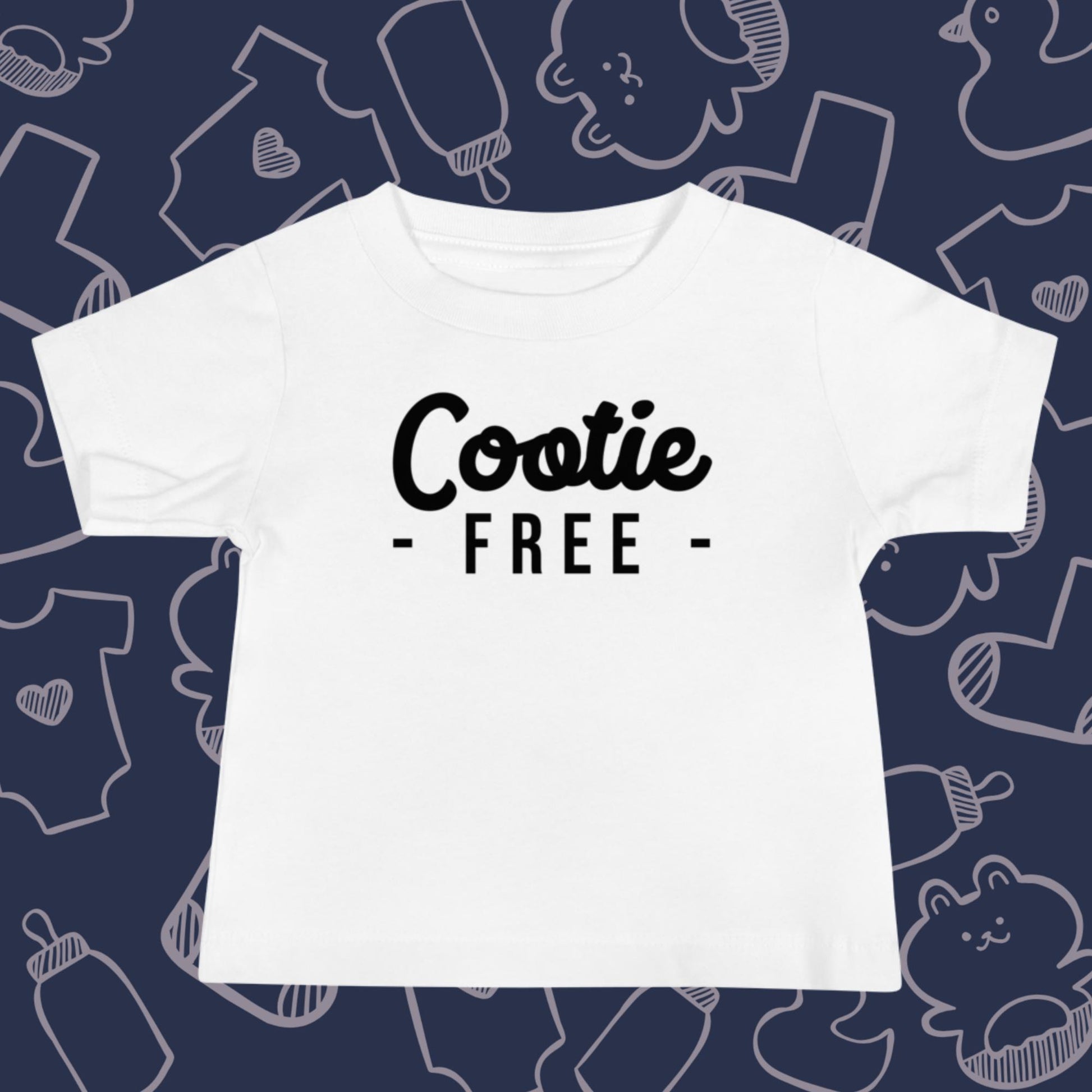 Funny, white baby t-shirt featuring the playful text "COOTIE FREE" against a whimsical, blue backdrop of ducks, socks, stuffed animals, baby bodysuits, and bottles