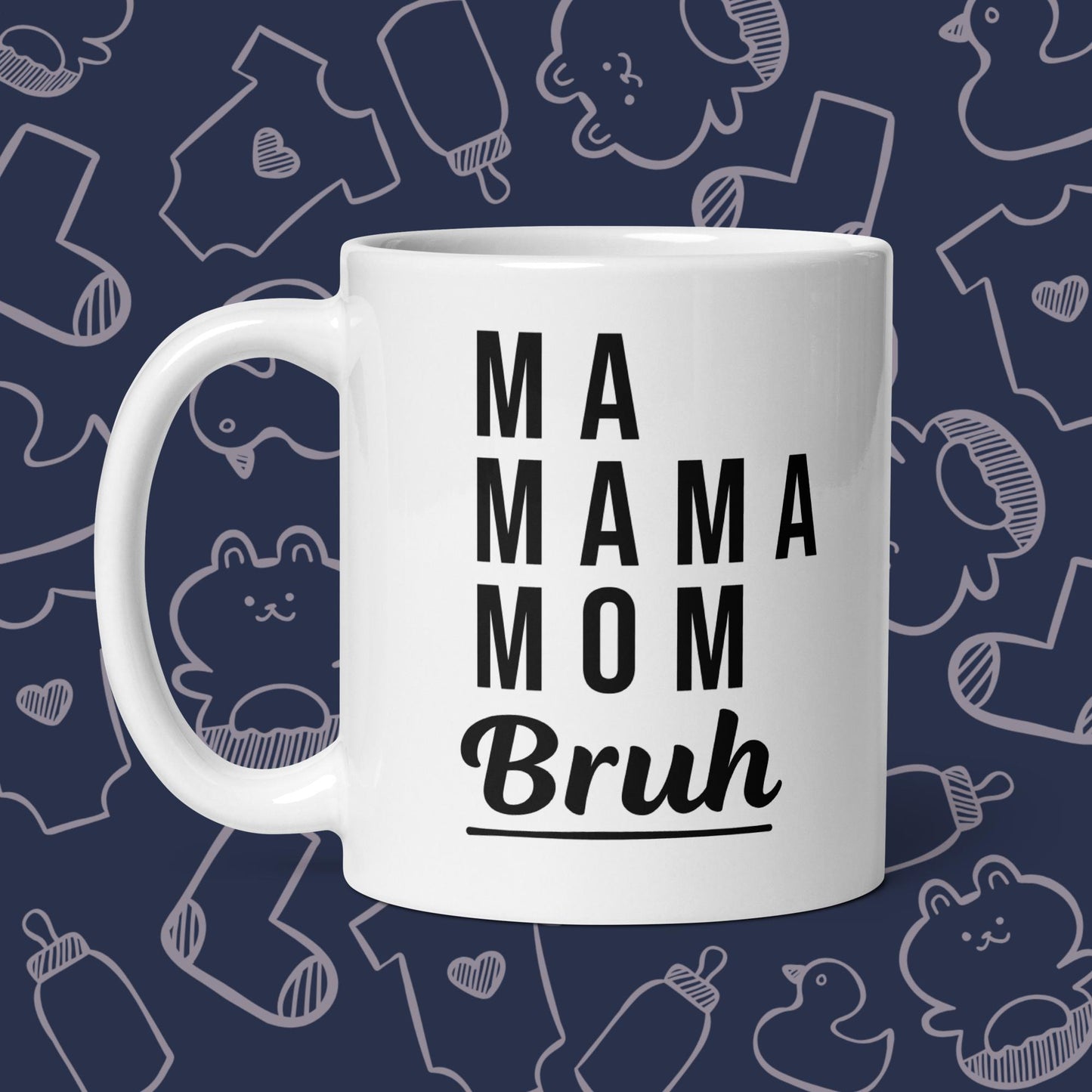 Funny, white coffee mug featuring the playful text "MA, MAMA, MOM, BRUH" against a whimsical, blue backdrop of ducks, socks, stuffed animals, baby bodysuits, and bottles