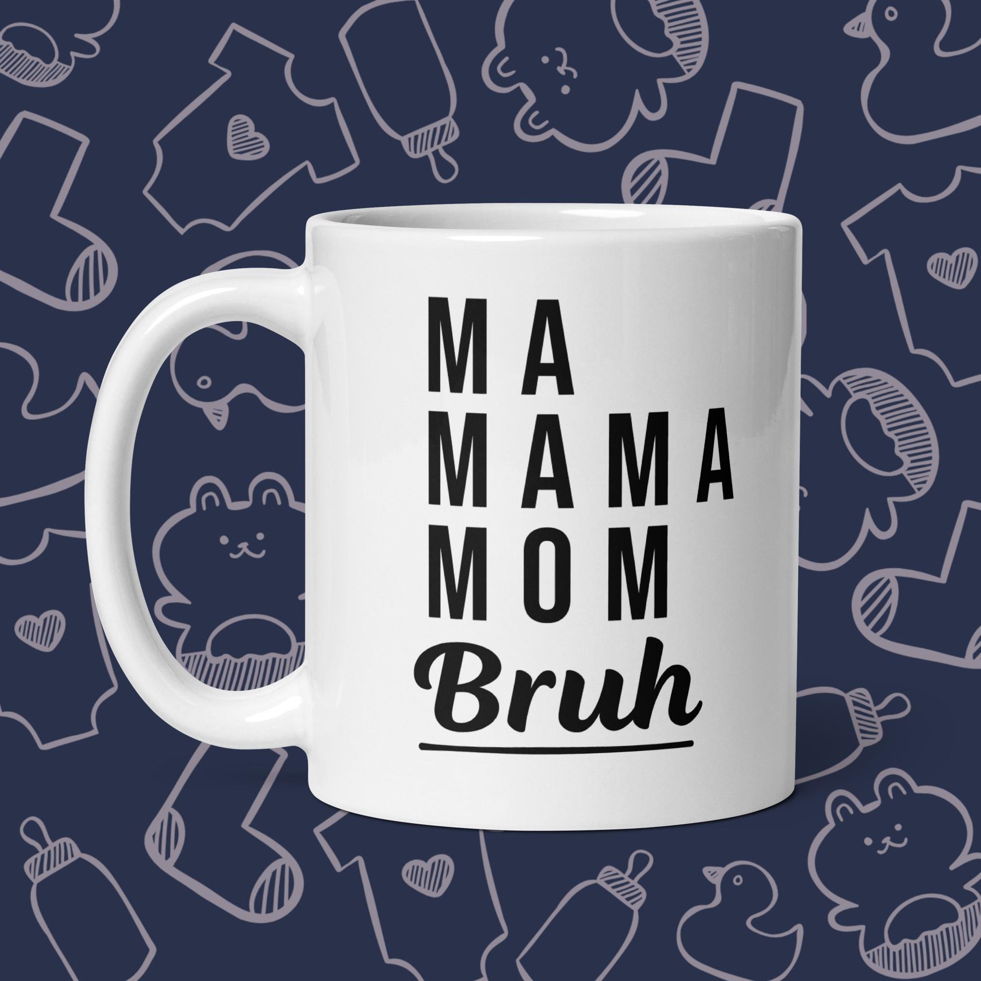 Funny, white coffee mug featuring the playful text "MA, MAMA, MOM, BRUH" against a whimsical, blue backdrop of ducks, socks, stuffed animals, baby bodysuits, and bottles