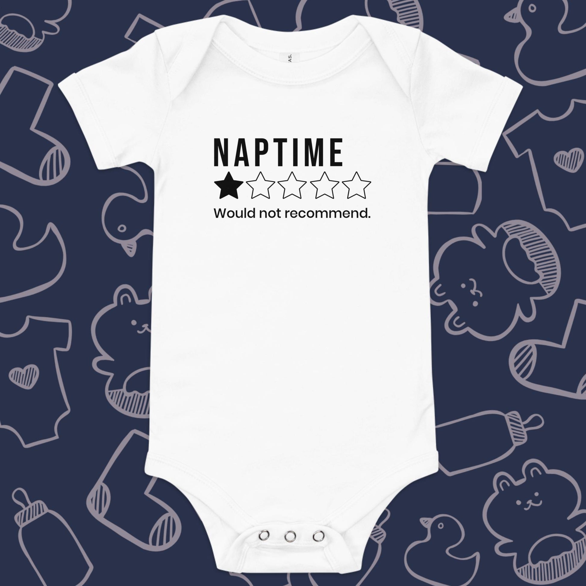 Funny, white baby onesie featuring a one star rating and the playful text "NAPTIME WOULD NOT RECOMMEND." against a whimsical, blue backdrop of ducks, socks, stuffed animals, baby bodysuits, and bottles